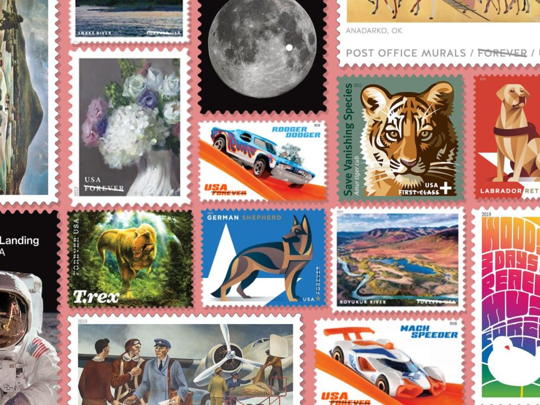 Diverse collection of colorful US postage stamps featuring various themes like space, animals, and vehicles.