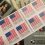 Sheets of U.S. 'Freedom' and 'Christmas' discount stamps on a money background.